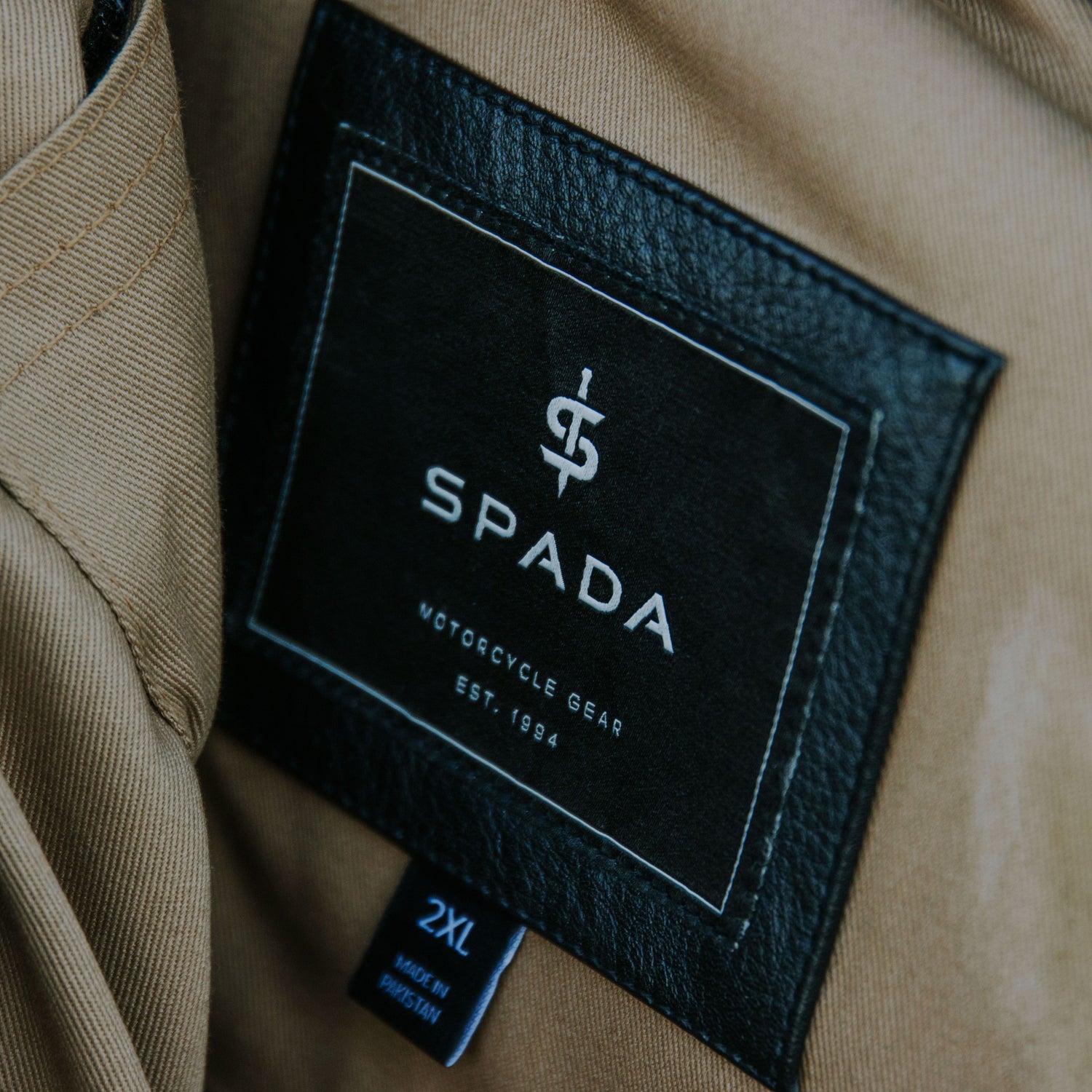 closeup of inner material and tag of mens jacket
