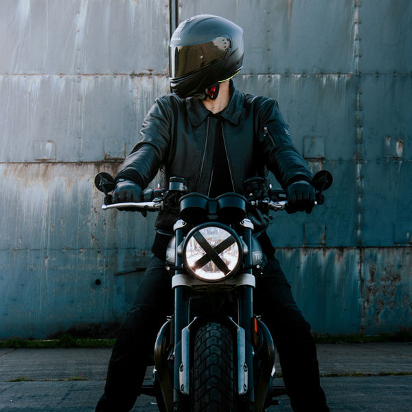 Front view of rider on motorbike wearing Turbine jacket minus the collar – bold and versatile styling