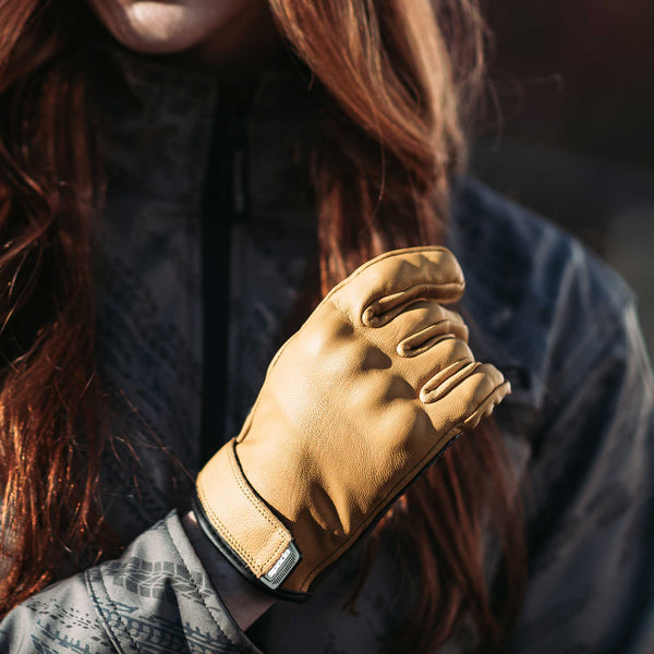 biker wearing tan yellow motorcycle gloves for women