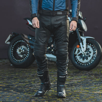 biker wearing black riding jeans for men with black touring spada boots