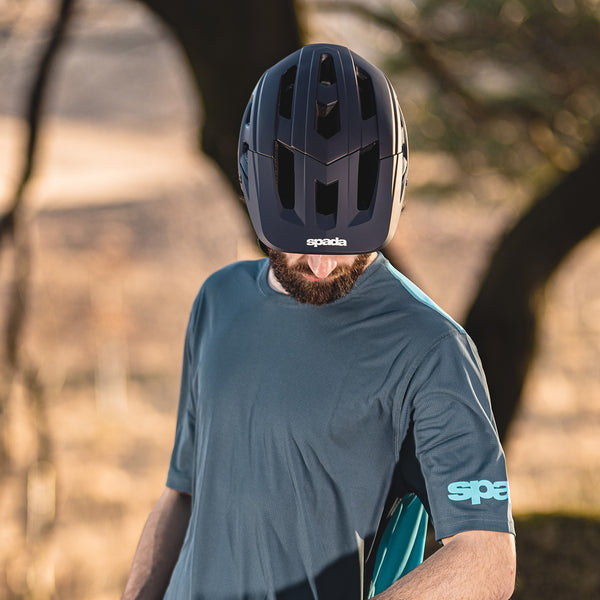 biker wearing mtb tshirt and black mountain biking helmet