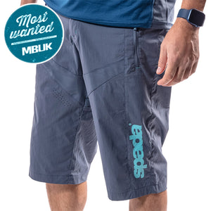 A pair of blue Spada MTB pro shorts with a relaxed fit and branded with the Spada logo. The shorts have a hook and loop waist adjuster, mesh pockets, and are designed for mountain biking.