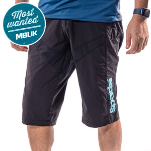 A pair of black mountain biking shorts with a relaxed fit, featuring a hook and loop waist adjuster, and branded with the Spada logo along the upper left leg.