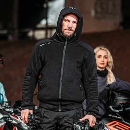 Male biker wearing Blade Black motorcycle hoodie fully zipped with hood up – ready for city rides or casual pit stops