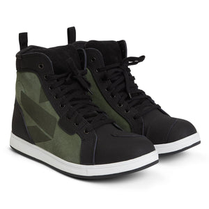 A pair of high-top motorcycle training shoes with a black and olive green color scheme, featuring suede and leather materials, reinforced toe and heel, and a waterproof membrane.